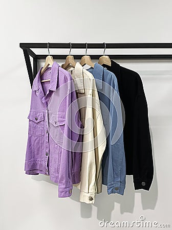 Women`s jeans jackets on a hanger in the store Stock Photo