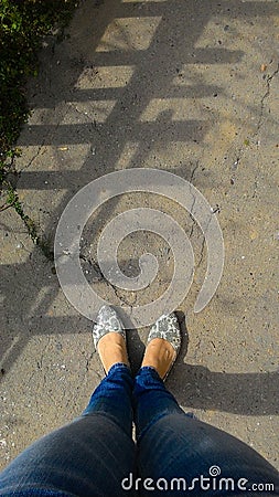 Women's legs in jeans and modern moccasins, top view Stock Photo