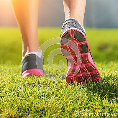 Women's running legs, pink-gray sports shoe detail Stock Photo