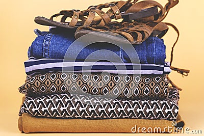 Women`s shoes, clothing and accessories on a colored background. Stock Photo