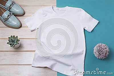 Women T-shirt mockup with turquoise loafers Stock Photo