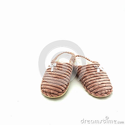 Women`s warm home slippers. Made of pink embossed plush Stock Photo