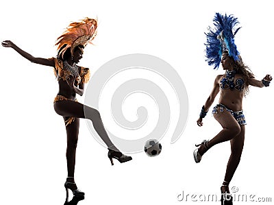 Women samba dancer playing soccer silhouette Stock Photo