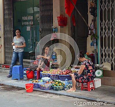 Women sell fruits on street market in Dalat, Vietnam Editorial Stock Photo