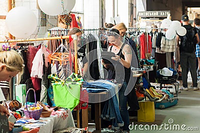 Women shopping inside the huge hall of market of vintage clothes Editorial Stock Photo