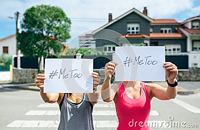 Women showing poster with metoo hashtag Stock Photo