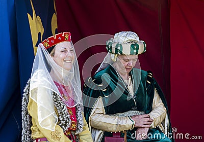 Women sitting in tent. Medieval Display. Warkworth, Northumberland. England. UK. Editorial Stock Photo