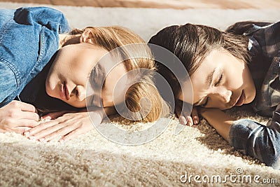 Women sleeping on carpet Stock Photo