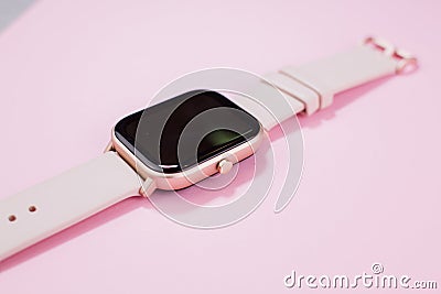 A women smart watch on pink background Stock Photo