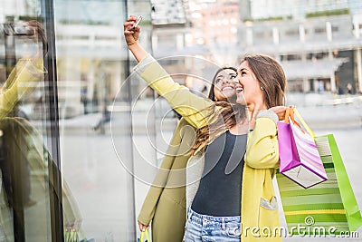 Women with smartphones in a bar Stock Photo