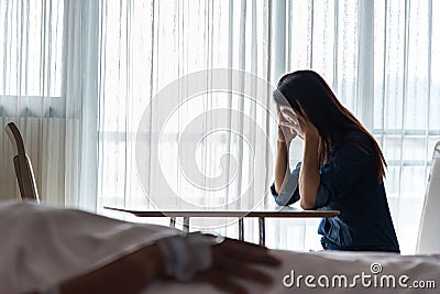 Women strain and worried for her friend in bed health condition in hospital room Stock Photo