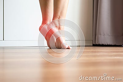 Women stretching and tiptoe foot in bedroom,Feet soles massage for plantar fasciitis,Close up Stock Photo