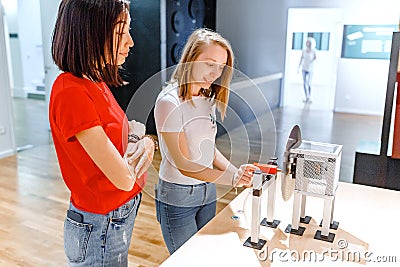 Students making experimental work in the field of mechanics and physics in modern laboratory Stock Photo