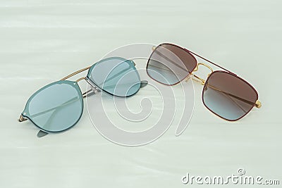 Women sunglasses in blue and deep pink for wearing in outdoors activities in holidays Stock Photo