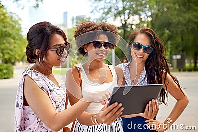 Women with tablet pc on street in summer Stock Photo