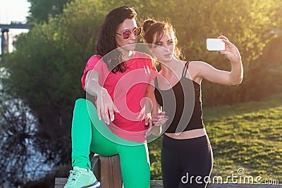 Women taking picture of herself, selfie at beach Lifestyle sunny image best friend girls happy vacations. Stock Photo