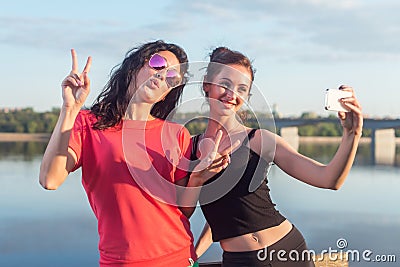 Women taking picture of herself, selfie at beach Lifestyle sunny image best friend girls happy vacations. Stock Photo