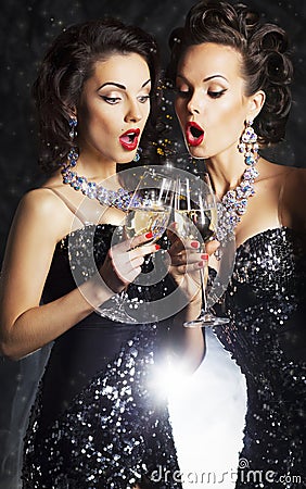 Women toasting at party with wineglasses Stock Photo