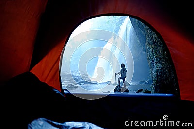 Women Trekkers or Female Explorer with Journey Enchanting Landscapes and Cascading Waterfalls, Pitching Tents in Enchanting Caves Stock Photo