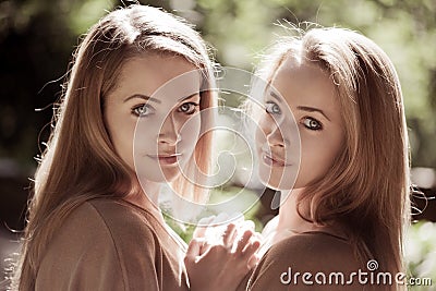 Women, twins in the forest Stock Photo