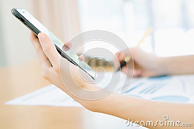 A Women using her Smartphone Stock Photo