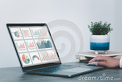 Women using laptop or notebook computer with data analysis graph dashboard, confident woman working with computer laptop concept, Stock Photo