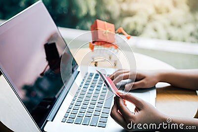 Women using laptop for shopping online and earn points to website Stock Photo