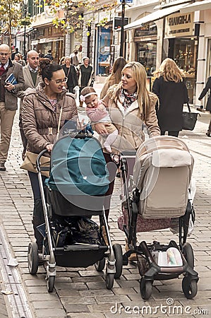 Women walking with baby carriages Editorial Stock Photo