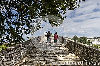 Women walking on the bridge looking at the View of Arachthos riv Editorial Stock Photo