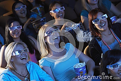 Women Watching 3D Movie In Theater Stock Photo