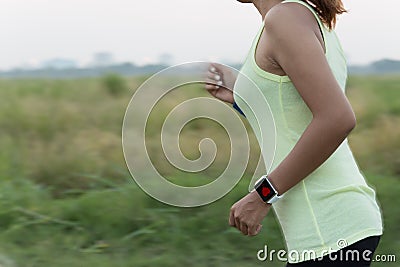 Women wear smart hand watch running Stock Photo
