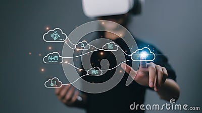 Women wear VR glasses and access Cloud Technology Internet Network data systems and databases through technology. Cloud computing Stock Photo