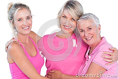 Women wearing pink tops and ribbons for breast cancer Stock Photo