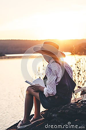 Women in winter sit read favorite book in the holiday, Concept girl reading a book Stock Photo