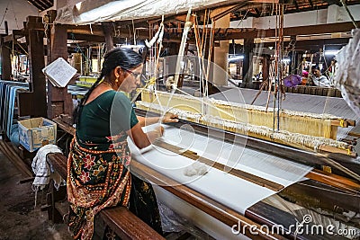 Women work in an old loom weaving cooperative in Kannur, Kerala, India Editorial Stock Photo