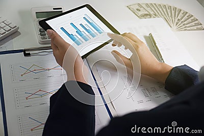 Women working in office. financial analysis with charts on tablet for business, accounting, insurance or finance concept Stock Photo