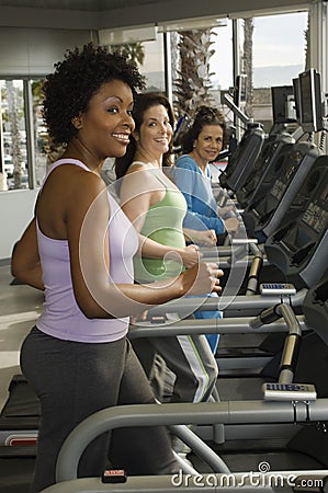 Women Working Out On Treadmill Stock Photo