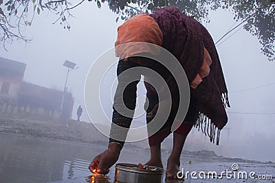 Morning pray on the bank of holy river Editorial Stock Photo