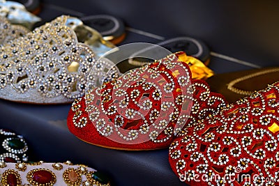 women& x27;s slippers decorated with semiprecious stones and beads on market in UAE Stock Photo