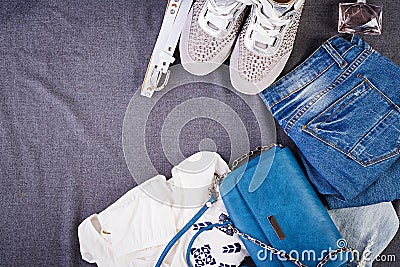 Women clothing, accessories, footwear blue blouse, jeans, terracotta shoes, bag. Fashion outfit. Shopping concept. Top view. Stock Photo