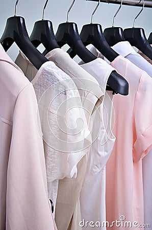 Womens clothing pastel colors hanging on the hanger vertical Stock Photo