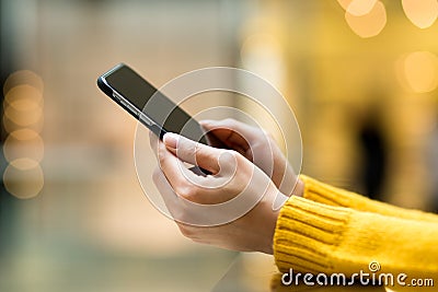 Womens hand using mobile phone Stock Photo