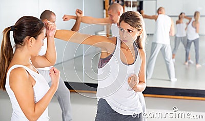 Womens sparring in self defense courses in gym Stock Photo