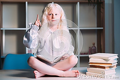 wonder kid discovery insight inspired girl book Stock Photo