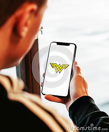 wonder woman on smartphone in hand realistic texture Editorial Stock Photo