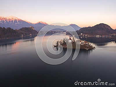 Wonderful Bright Autumn landscape during sunset. Awesome Fairy tale lake Bled in Julian Alps, Slovenia, Europe. Stock Photo