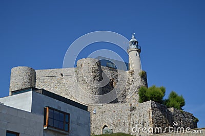 Wonderful Castle Lighthouse Santa Ana Dated In The 12th Century On The Promenade In Castrourdiales. August 27, 2013. Editorial Stock Photo