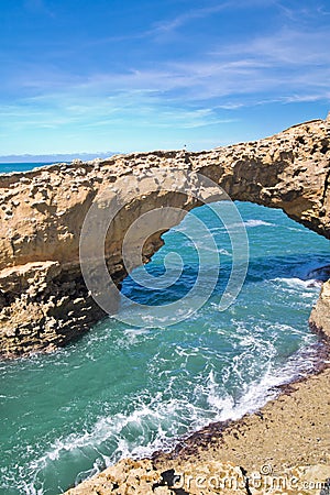 Wonderful cliffs on atlantic coastline with turquoise ocean wave erosion caves in biarritz, basque country, france Stock Photo