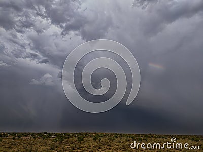 Wonderful clouds with rain and small rainbow in Rajasthan Stock Photo