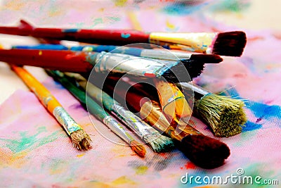 Artistic paintbrushes and palette - colorful world Stock Photo